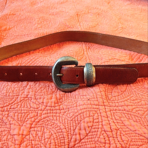 Leather belt, brown 38x1 in. No noted brand on it.